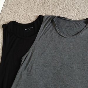 Set of two Pure Barre tanks.